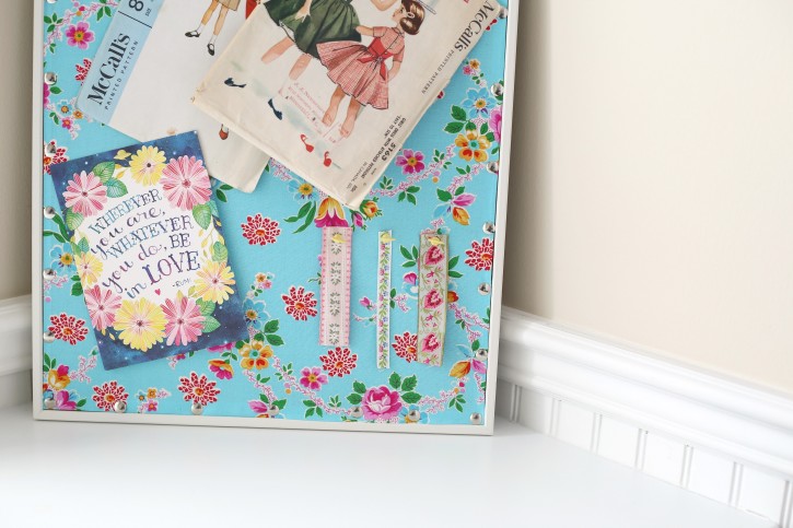 Easy Cork Board Makeover by Lindsay Wilkes from The Cottage Mama. This idea is SO easy and inexpensive!